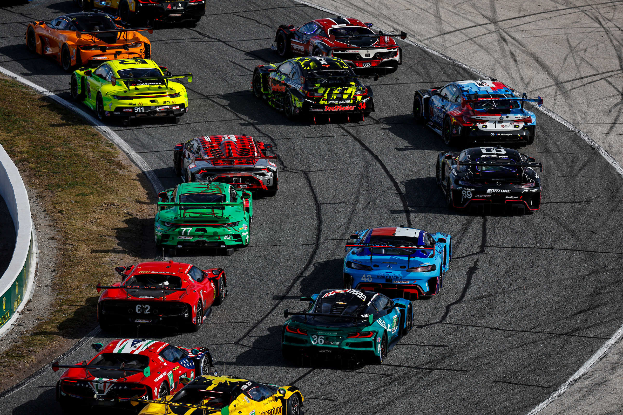 GT field through a corner at the Rolex 24